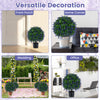 Set of 2 artificial lavender topiary ball trees in weighted pots, perfect for versatile decoration in any space.