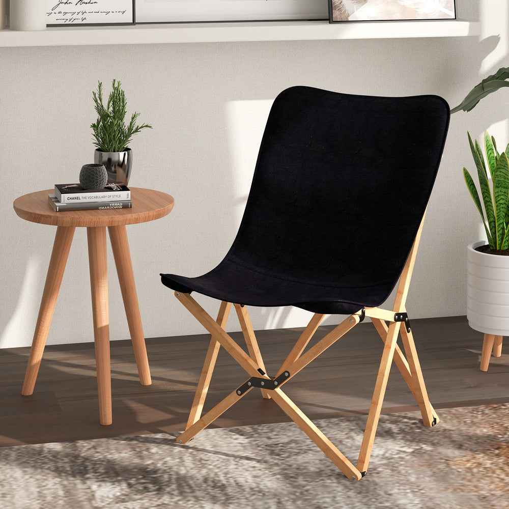 Black bamboo folding chair with storage pocket, featuring a breathable surface for outdoor activities and easy storage.