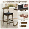 Bar stool with curved back and faux leather seat, featuring rubber wood legs and footrests, ideal for dining or cafes.