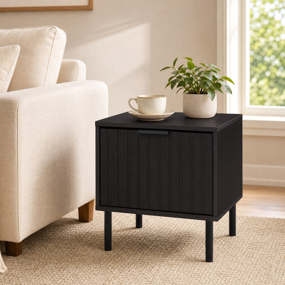 Black modern nightstand featuring a vertical-striped storage drawer, perfect for compact bedside layouts and refined decor.