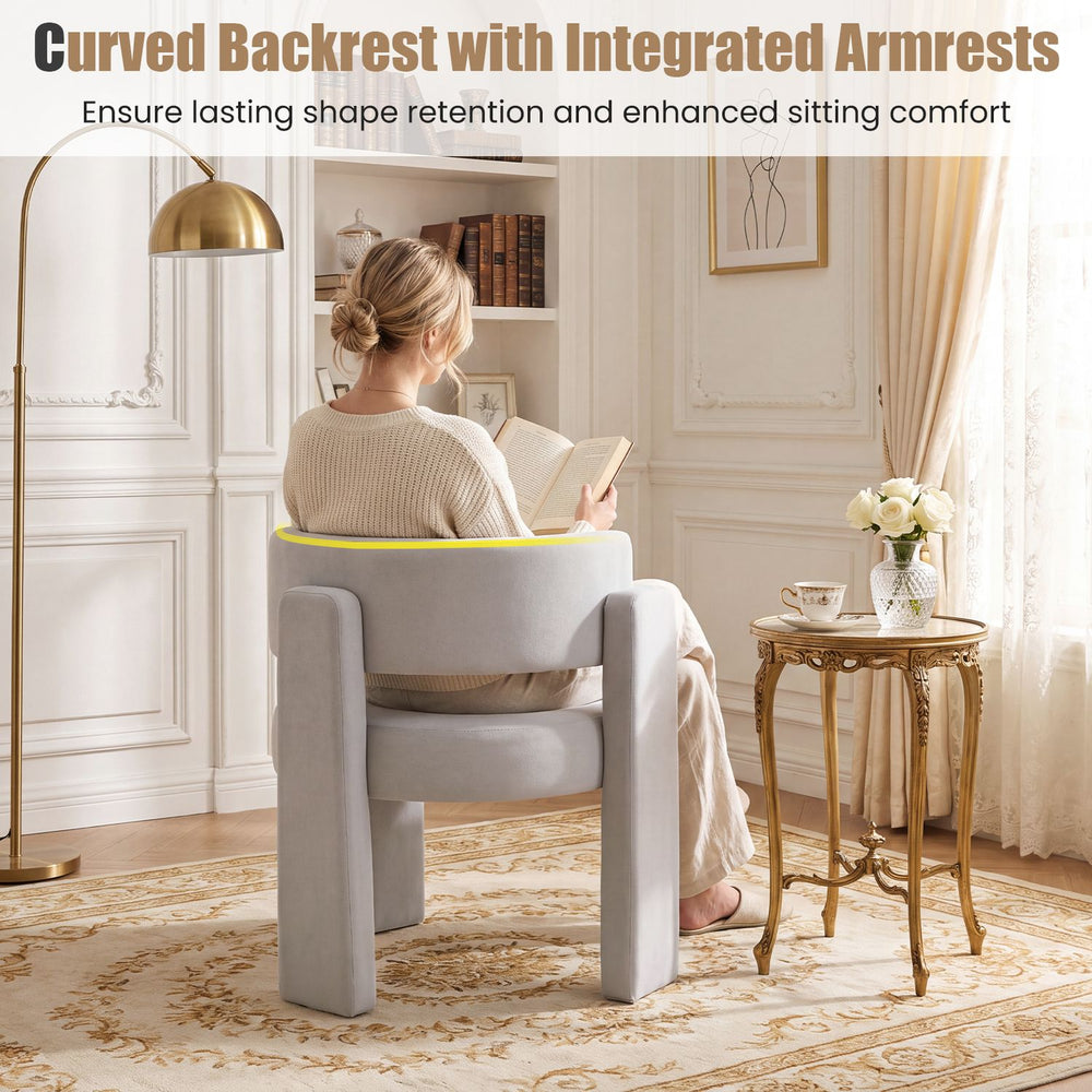 Comfy gray velvet barrel accent chair with curved backrest and integrated armrests for enhanced sitting comfort.