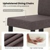 Close-up of a brown upholstered dining chair with a 3.5" thick seat cushion, featuring breathable faux linen fabric.