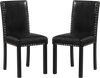 Set of 2 black dining chairs with solid rubber wood legs, padded seats, and elegant nailhead accents for versatile use.