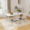 Set of two white dining chairs with solid wood legs and thick cushions, ideal for comfort in dining areas.