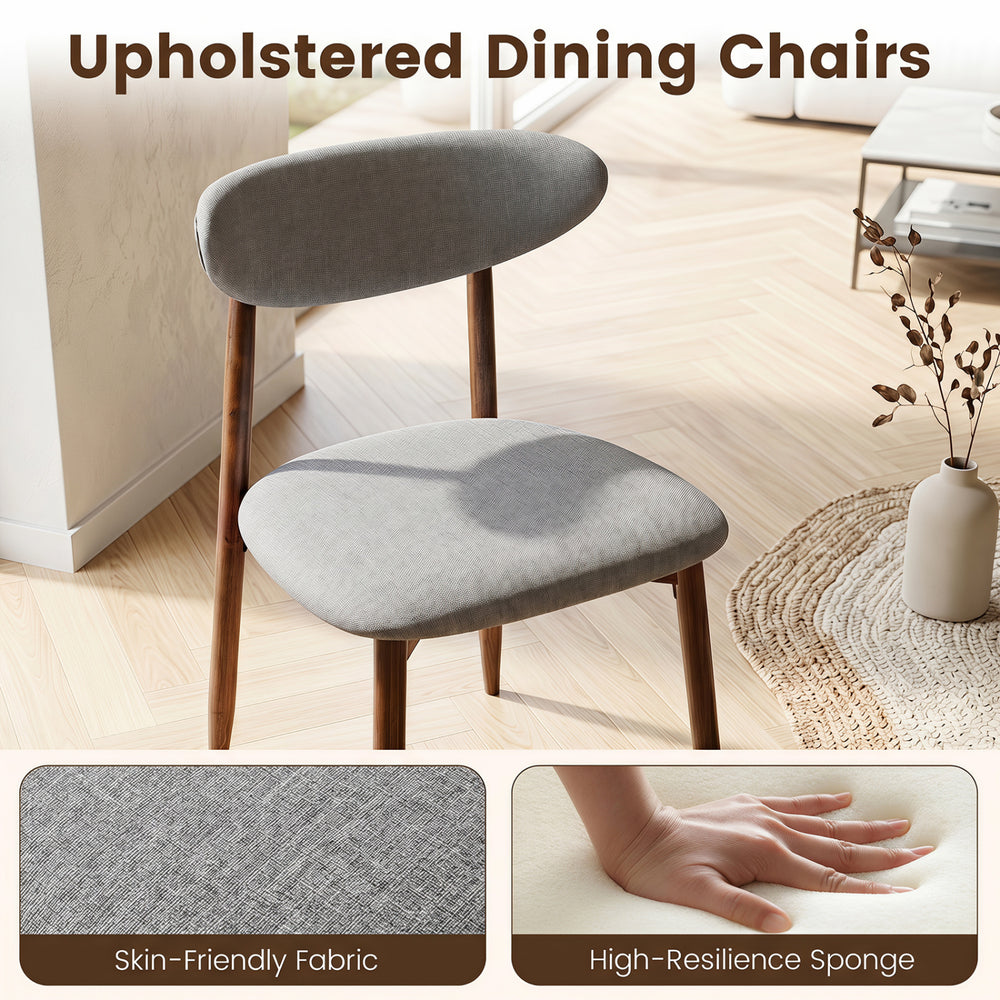 Gray upholstered dining chair with a curved back, padded seat, and solid rubber wood legs for modern farmhouse dining.
