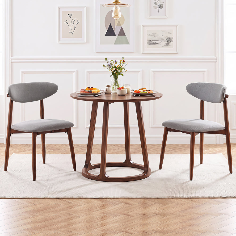 Set of 2 gray fabric upholstered dining chairs with curved backs, featuring solid rubber wood for durability and comfort.