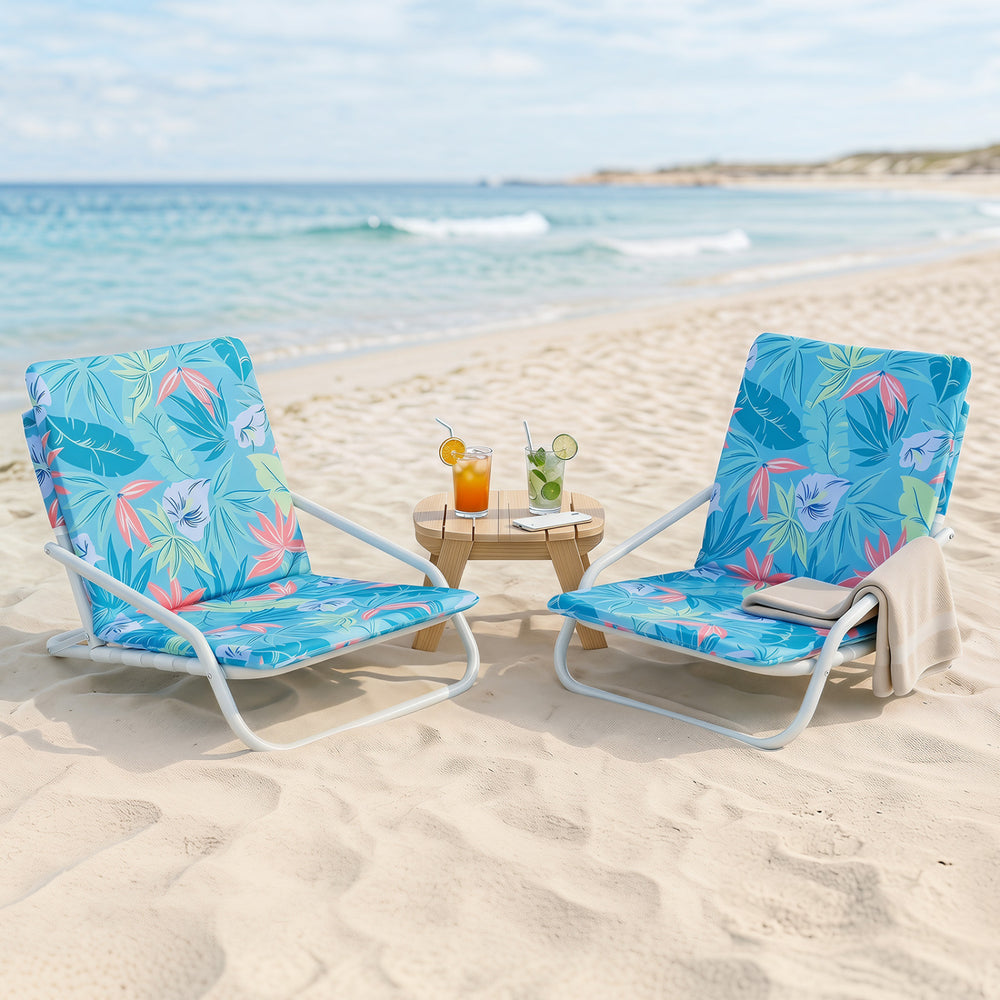 Two folding beach chairs with sponge padded seats in vibrant colors, perfect for camping and beach relaxation.