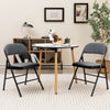 Folding chair set with upholstered seats and fabric backrests, perfect for dining rooms or meetings, featuring a.