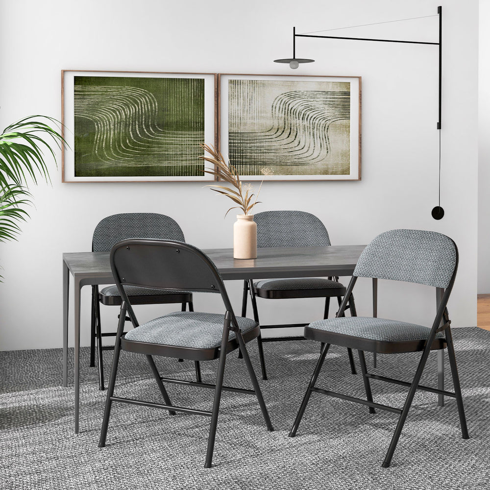 Folding chair set with upholstered seats and fabric-covered backrests, perfect for dining or meeting rooms.