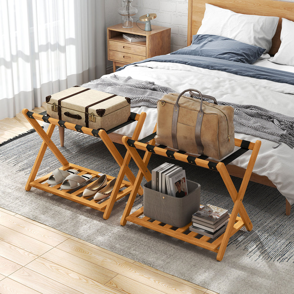Set of 2 folding luggage racks in acacia wood with nylon straps and slatted shelf, perfect for bedroom organization.