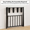 Folding metal luggage rack in black with two compartments, ideal for suitcase and bag storage in modern spaces.