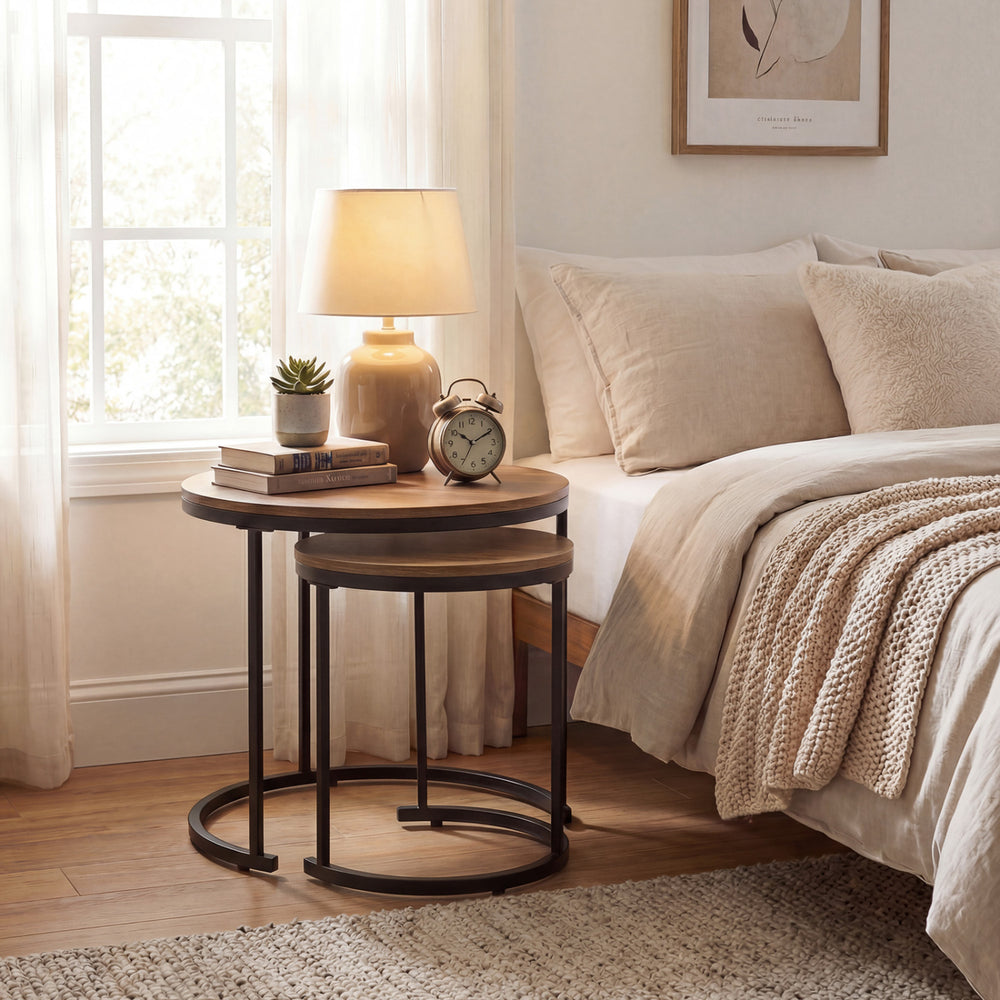 Set of 2 modern round nesting coffee tables in light brown, perfect for small spaces and versatile use in living rooms.