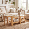 Nesting coffee tables with natural wood and rattan accents, featuring tempered glass tops for versatile living room use.