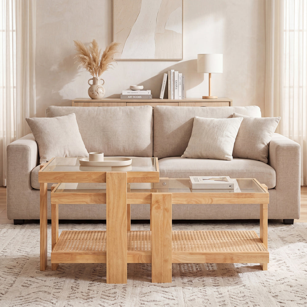 Nesting coffee tables with natural rubber wood and rattan accents, featuring tempered glass tops for versatile living.