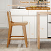 Counter height bar stool with teak wood frame and woven paper rope, ideal for outdoor patios and kitchen islands.