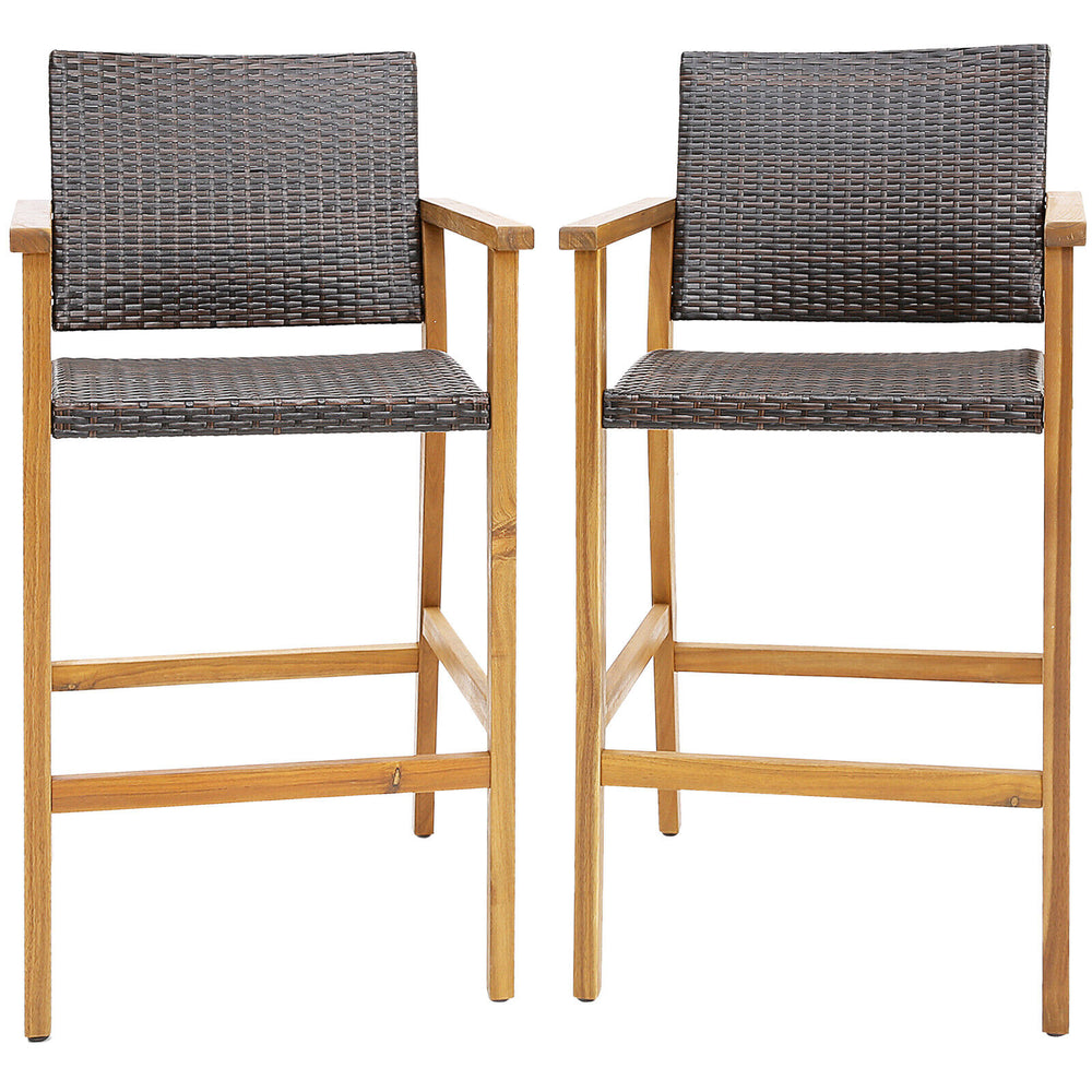 Set of 2 PE wicker patio bar chairs with acacia wood armrests, featuring a curved seat and adjustable footpads for.