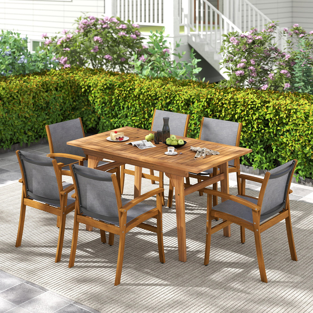 Close-up of acacia wood frame and breathable fabric of a patio dining chair, showcasing its rustic charm and durability.