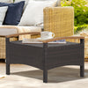 Wicker patio ottoman in mix brown PE wicker with acacia wood handles, ideal for outdoor seating or side table use.