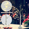 Pre-lit white twig birch tree with flexible branches and realistic bark texture, perfect for indoor holiday decoration.
