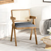 Rattan accent chair with gray padded cushion and rubber wood frame, designed for comfort and farmhouse style in any.