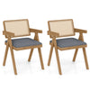 Set of 2 gray rattan accent chairs with padded cushions and rubber wood frame, ideal for dining or living room decor.