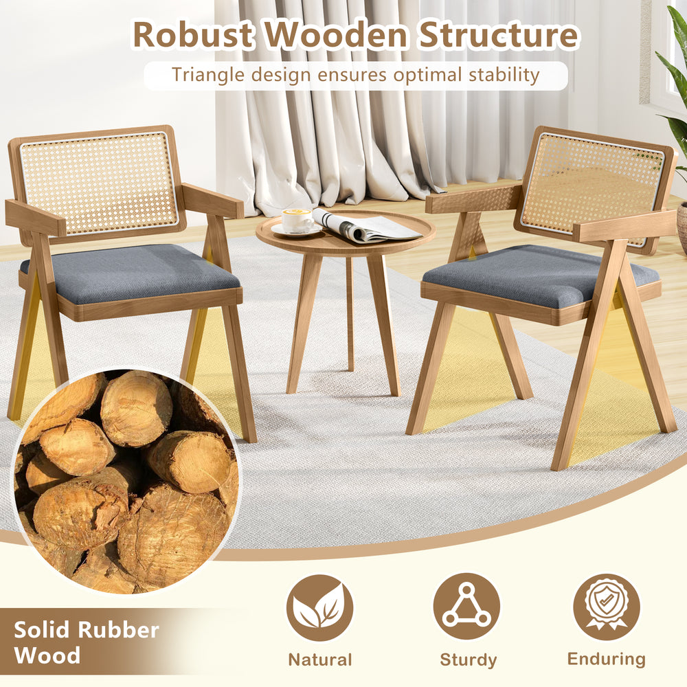 Set of 2 gray rattan accent chairs with padded cushions and solid rubber wood frame, ideal for dining or living rooms.
