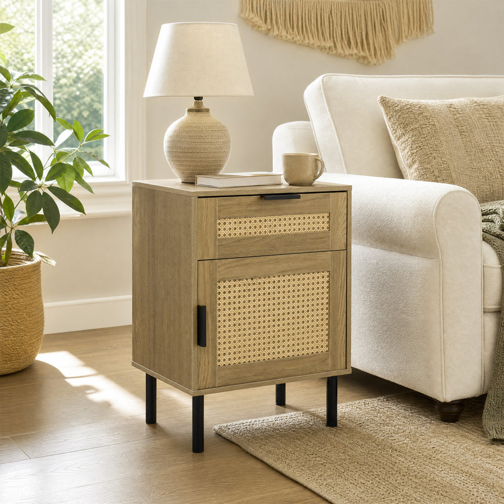 Rattan nightstand with drawer and storage cabinet, featuring a natural finish and metal legs, perfect for bedroom use.