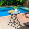Round patio side table with tempered glass top and black powder-coated frame, ideal for small indoor and outdoor spaces.