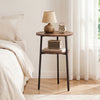 Round side table in rustic brown with a metal frame and storage shelf, ideal for living room or bedroom use.
