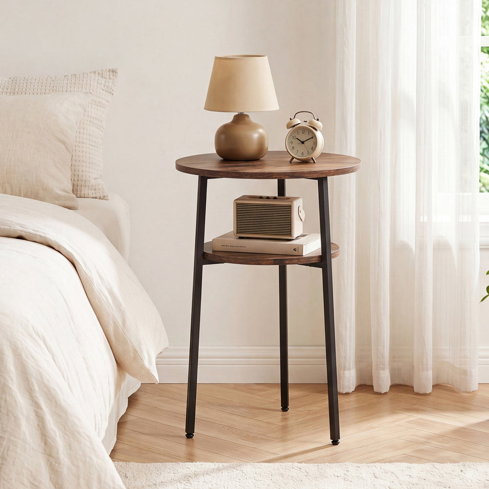 Round side table in rustic brown with a metal frame and storage shelf, ideal for living room or bedroom use.