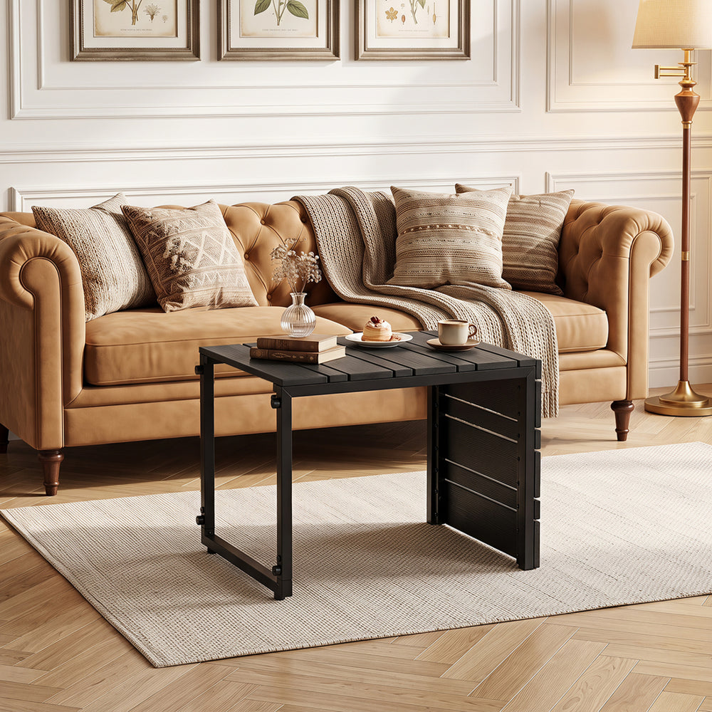 Black C-shaped side table featuring a slatted wood-plastic top, ideal for use in living rooms or alongside outdoor seating.