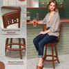 Swivel bar stool with ergonomic curved backrest and round footrest, made of rubber wood, ideal for stylish seating.