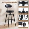 Black swivel barstool with padded seat and backrest, featuring a sturdy metal frame and adjustable foot pads for.