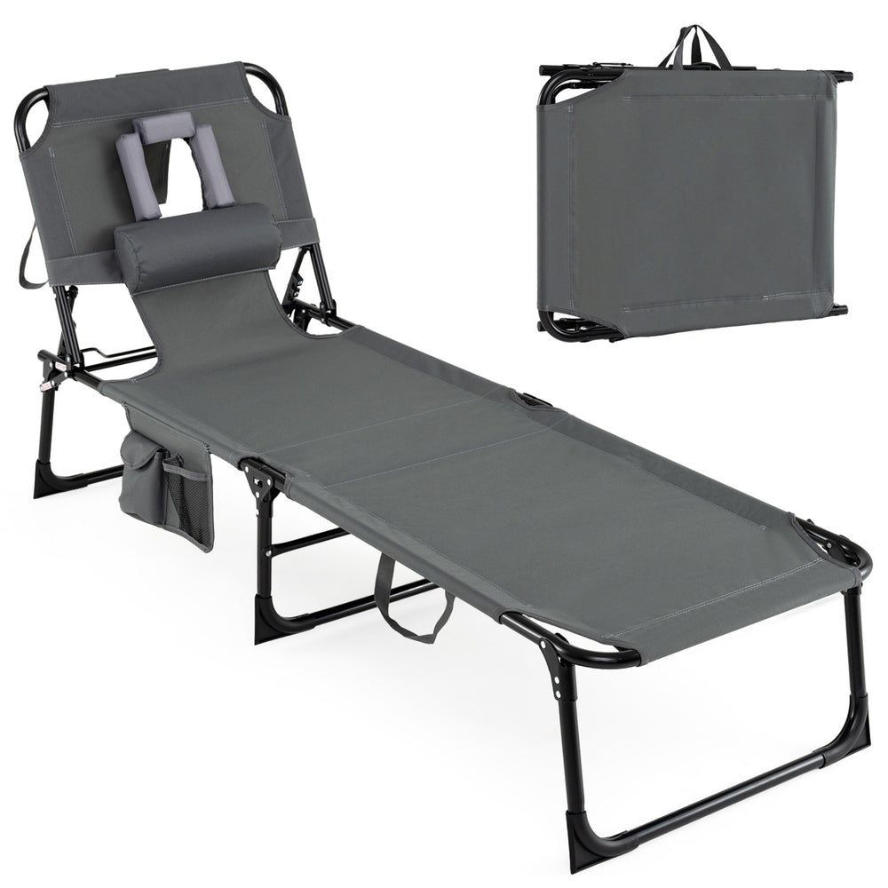 Portable gray tanning chair with adjustable backrest, removable pillow, and storage pockets for outdoor relaxation.