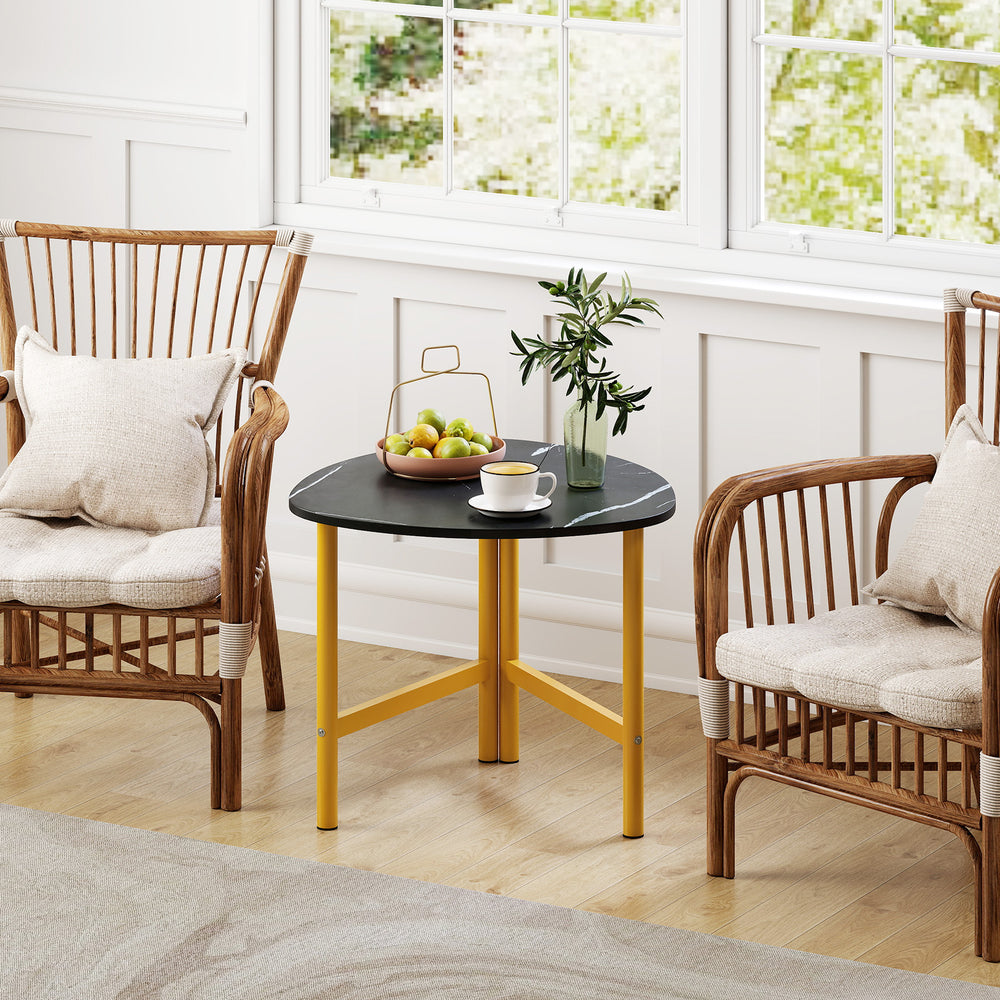Triangle coffee table with black top and yellow metal legs, perfect for versatile use in modern living spaces.