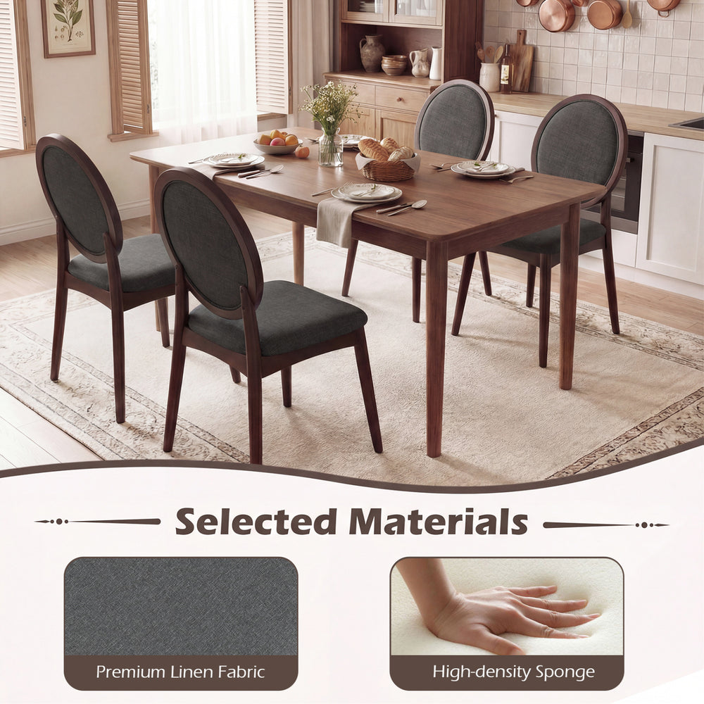 Set of two black upholstered linen fabric kitchen side chairs with padded seats and ergonomic backrests for comfort.