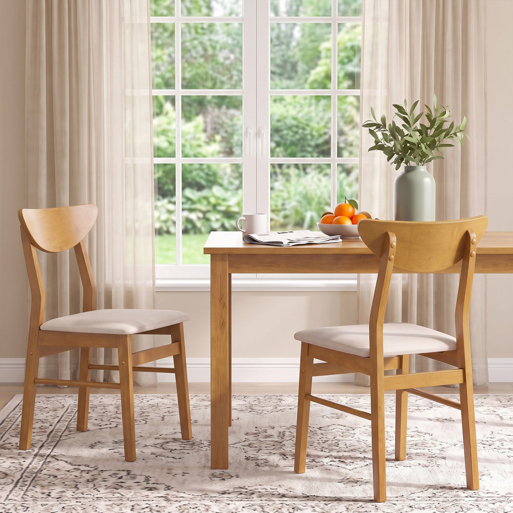 Set of 2 upholstered dining chairs with curved backrest and rubber wood frame, perfect for dining or kitchen spaces.