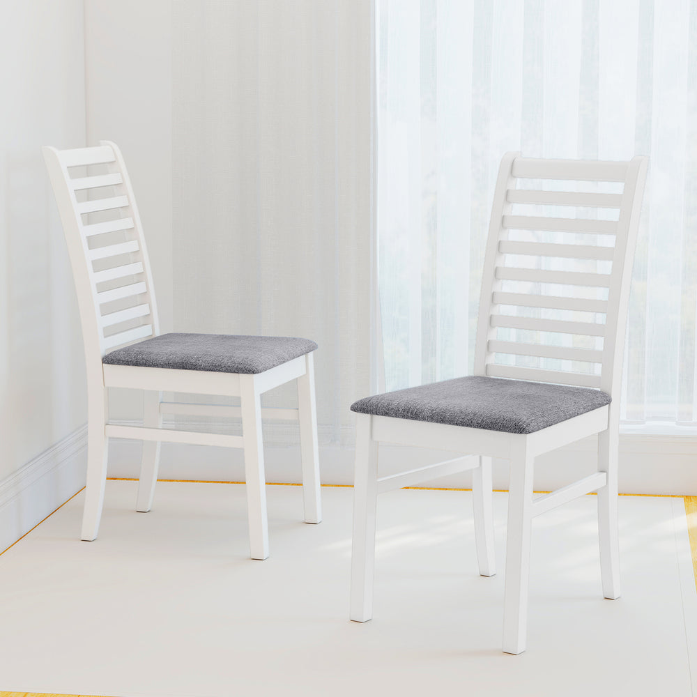 Set of 2 white wooden dining chairs with rubber wood legs and padded seats, perfect for living room or dining area.