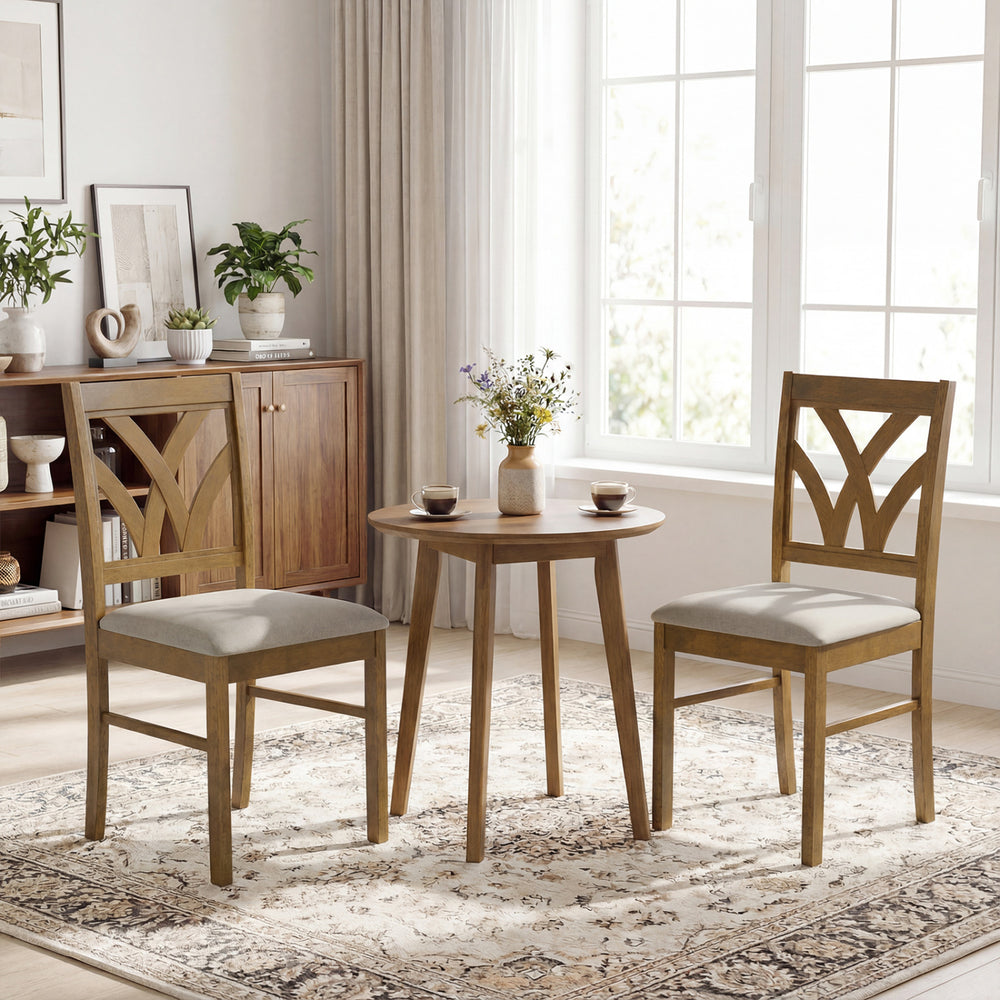 Set of 2 oak dining chairs with hollowed backrest and soft padded seat, perfect for kitchen or dining room use.