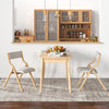 Natural wooden folding dining chairs with linen fabric padded seats, perfect for compact spaces in living rooms or.