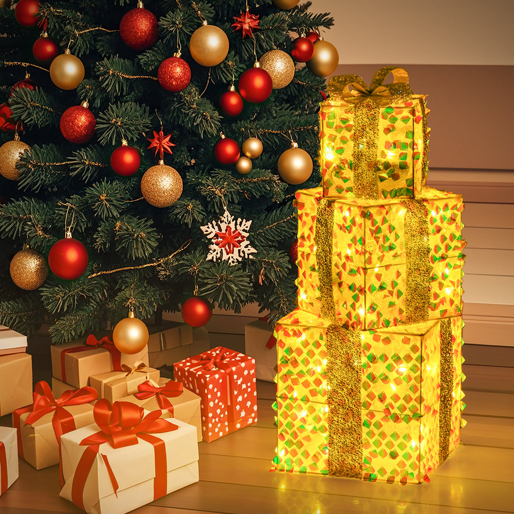 Three lighted Christmas gift boxes with bows, featuring 90 warm LED lights, perfect for festive home decoration.