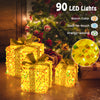 Set of 3 Christmas lighted gift boxes with 90 warm LED lights and festive bows, perfect for holiday decoration.