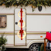 Three lighted Christmas wreaths with bows on a red ribbon, featuring warm white LEDs, perfect for festive outdoor decor.