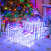 Iridescent Christmas gift boxes with bows, showcasing their charming design and bright lights for festive indoor.
