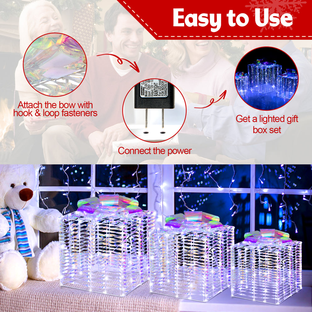 Set of 3 iridescent Christmas gift boxes with bows, featuring 156 cold white lights for festive outdoor decoration.