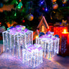 Set of 3 iridescent Christmas gift boxes with bows, illuminated by 156 cold white lights for festive outdoor decoration.