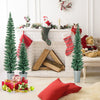 Arrangement of three potted artificial Christmas trees in silver metal buckets, ideal for corner decoration during the.