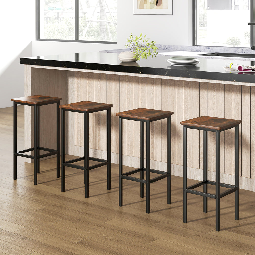 Set of 4 rustic brown bar stools with metal legs, featuring ergonomic footrests for comfort at a kitchen island.