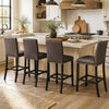 Set of 4 brown bar stools with backrest, padded seat, and rivet design, perfect for kitchen island or dining areas.