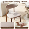 Beige upholstered dining chair featuring a curved back, padded seat, and skin-friendly fabric for comfortable seating.